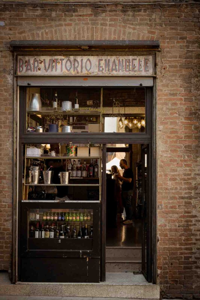 Entrance to a traditional café in Ravenna with its name displayed above the doorway.