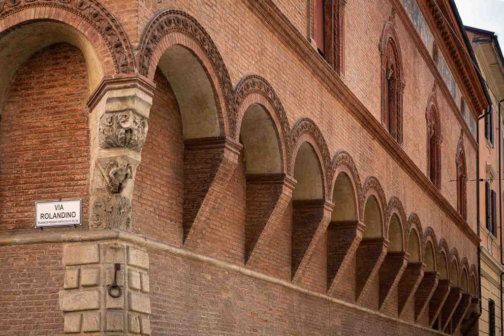 Medieval brick porticoes on Via Rolandino in Bologna.